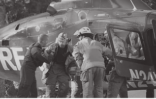 Emergency responders unloading a patient from a helicopter